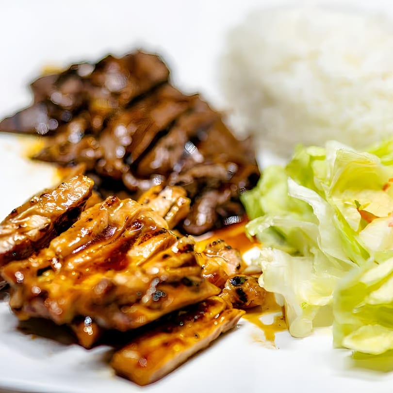 Jackpot Teriyaki's chicken and beef teriyaki with white rice and a side salad.